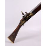 A LONG 19TH CENTURY NORTH AFRICAN RIFLE, with gilt metal mounts, octagonal barrel, with bone and