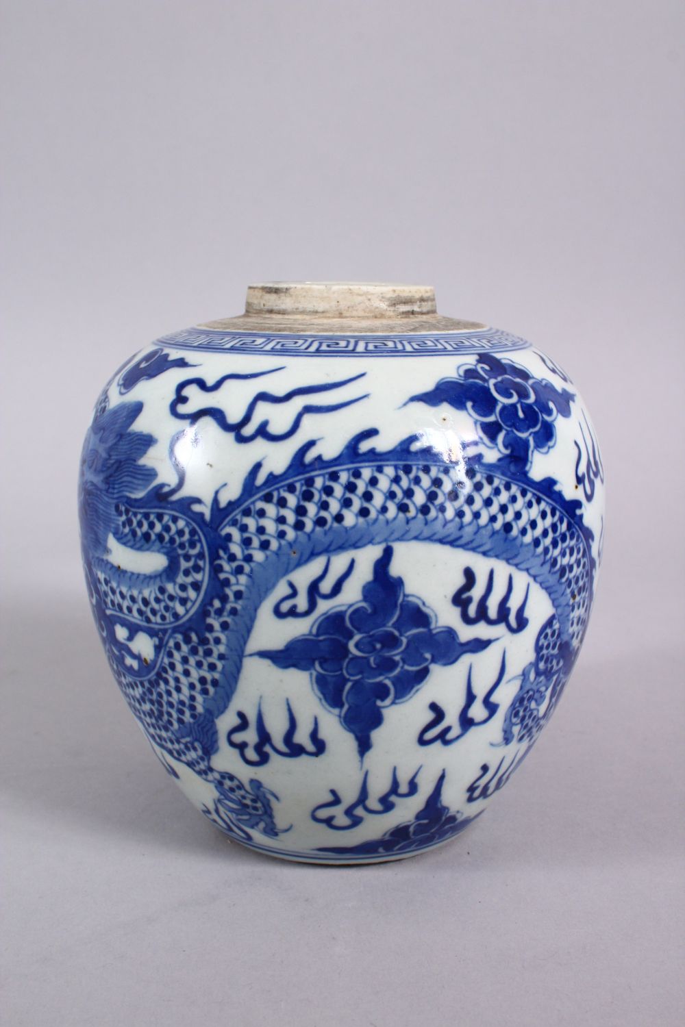 A CHINESE BLUE & WHITE PORCELAIN DRAGON GINGER JAR, decorated with a dragon amongst clouds 14cm - Image 4 of 5