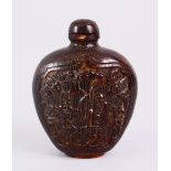 A 19TH CENTURY CHINESE CARVED HORN SNUFF BOTTLE, carved with scenes of an immortal with deer, in