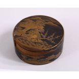 A JAPANESE TAISHO PERIOD DAMASCENE LACQUER BOX AND COVER, with views of landscapes and buildings,