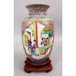 A GOOD CHINESE REPUBLIC PERIOD FAMILLE ROSE PORCELAIN LANTERN VASE & STAND, decorated with panels of