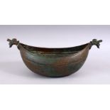 A GOOD PERSIAN BRONZE TWIN HANDLE BEGGING BOWL / KASHKOOL. with bands of carved calligraphy, and
