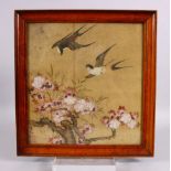 A 19TH / 20TH CENTURY CHINESE PAINTED SILK PICTURE OF BIRDS AMONGST FLORA - the birds in flight