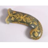 A 19TH / 20TH CENTURY CARVED JADE MUGHAL DAGGER HANDLE - with carved and gilded motif decoration,