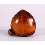 A JAPANESE MEIJI PERIOD CARVED BOXWOOD NETSUKE OF TWO CHESTNUTS, the himotoshi formed to the base,