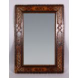 A 19TH CENTURY ISLAMIC SPANISH INLAID WOOD & MOTHER OF PEARL MIRROR- the frame inlaid with exotic