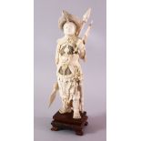 A LARGE 19TH CENTURY CHINESE CARVED IVORY FIGURE OF A WARRIOR, carved in his traditional armour