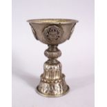 A GOOD 19TH CENTURY SINO TIBETAN WHITE METAL STEM CUP, with buddhistic object decoration, 11.5cm