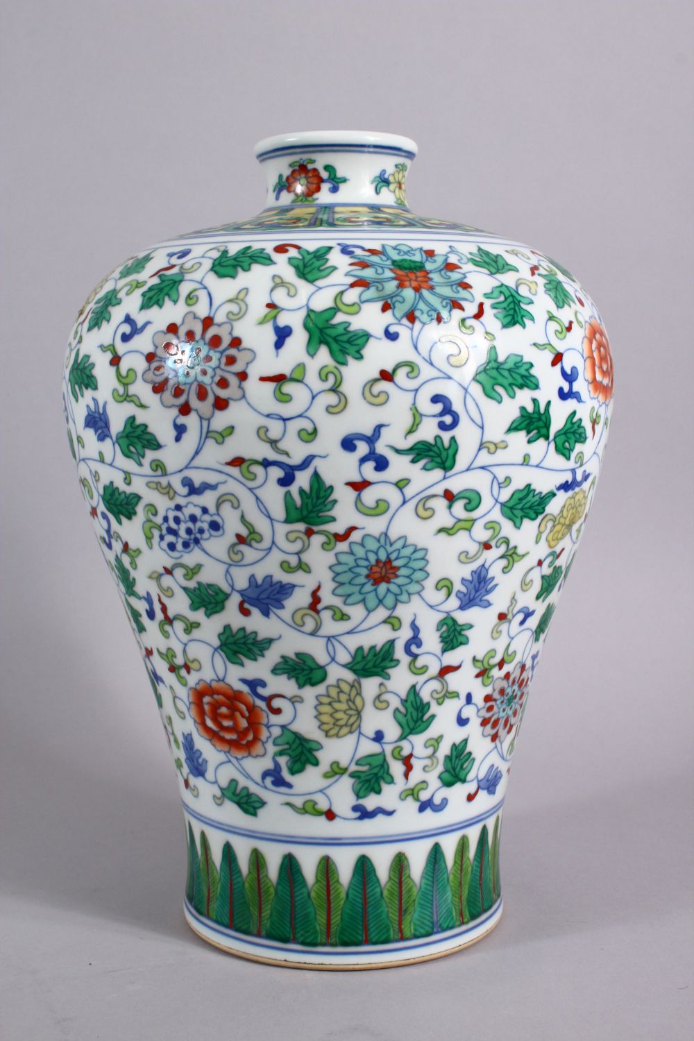 A CHINESE DOUCAI DECORATED PORCELAIN MEIPING VASE, decorated with formal scrolling lotus, and lappet - Image 4 of 9