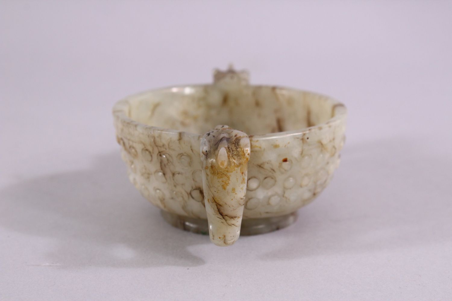 A CHINESE CARVED JADE ARCHAIC STYLE TWIN HANDLE CUP, with chilong handles, and boss decoration, 11cm - Image 2 of 6