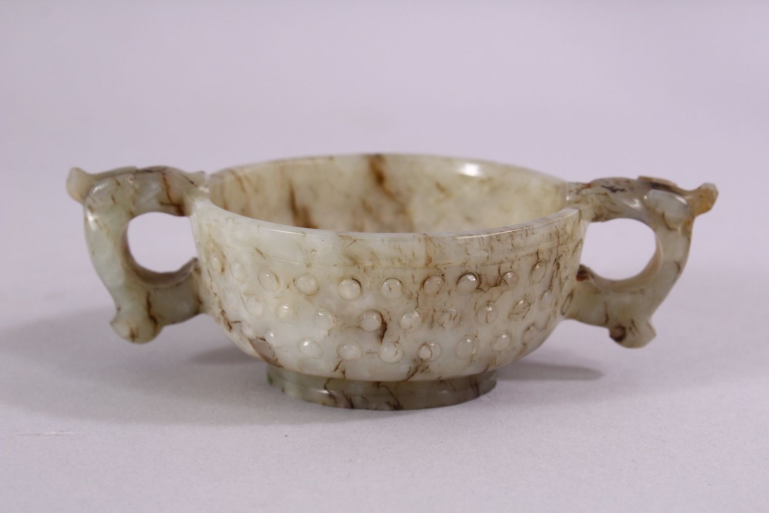 A CHINESE CARVED JADE ARCHAIC STYLE TWIN HANDLE CUP, with chilong handles, and boss decoration, 11cm - Image 3 of 6