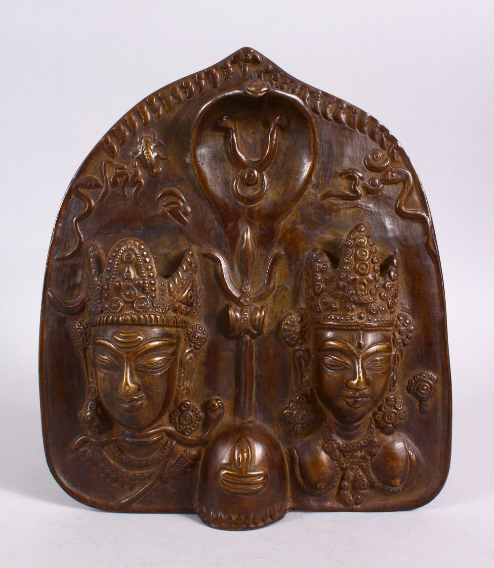 AN INDIAN BRONZE RELIEF WALL HANGING PANEL, depicting two figures, one semi erotic, the verso with