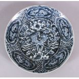 A CHINESE SHIPWRECK STYLE BLUE & WHITE PEACOCK DISH, 27CM