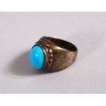 A 19TH CENTURY ISLAMIC SILVER AND TURQUOISE RING, 2.5cm high.