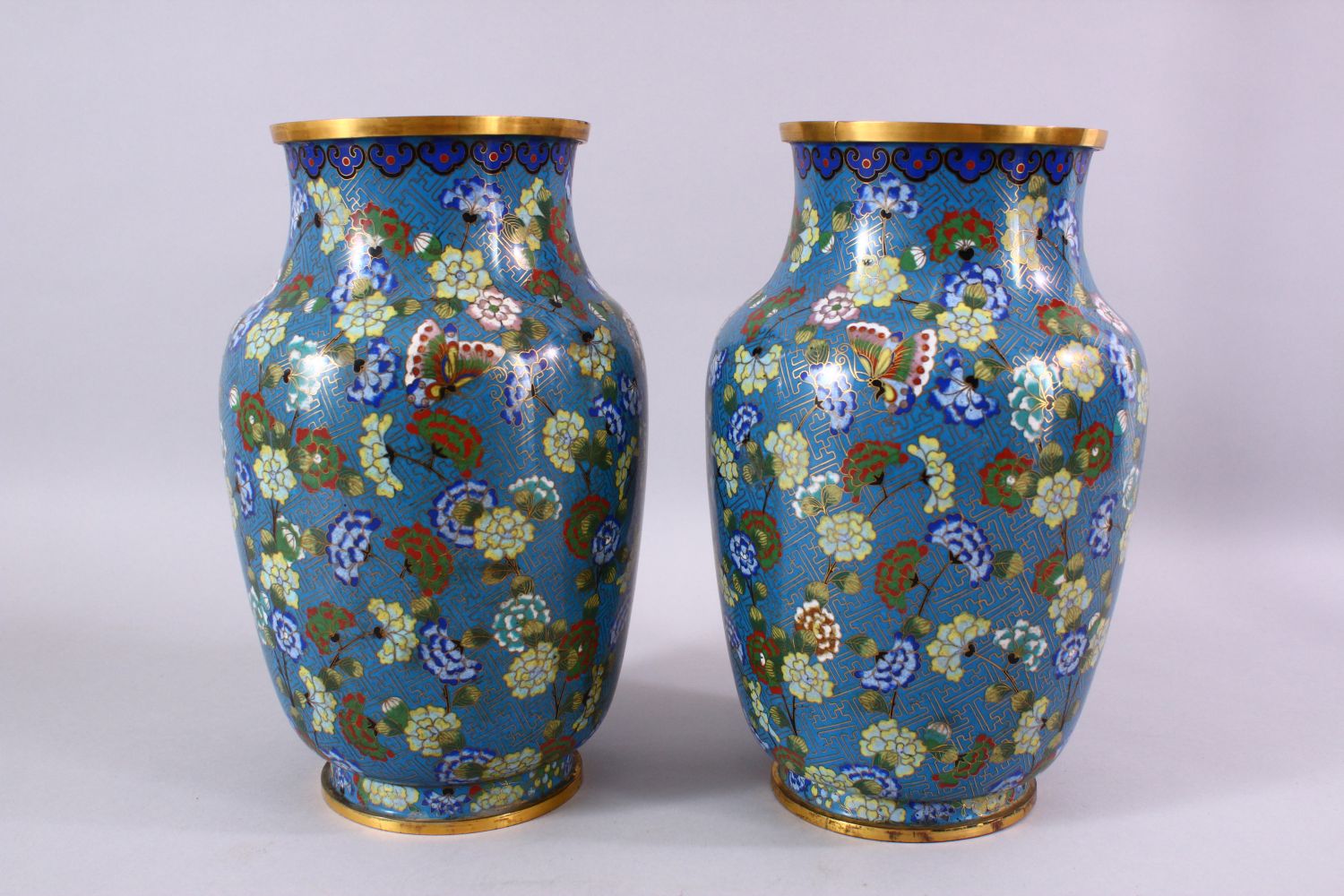 A LARGE PAIR OF 19TH / 20TH CENTURY CHINESE CLOISONNE VASES, each decorate with an array of flora - Image 4 of 6