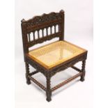 AN 18TH / 19TH CENTURY CEYLONESE CARVED ROSEWOOD CHAIR, with carved panels and wicker woven seat,