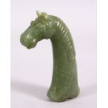 A GOOD ISLAMIC MUGHAL CARVED JADE HORSE HEAD DAGGER HANDLE, carved with a horses head, 11.5cm.