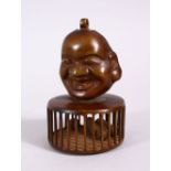 A CHINESE BRONZE CHILDRENS RATTLE OF BUDDHA, the top with a mask of buddha, the cage with balls to