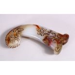 A 19TH / 20TH CENTURY CARVED JADE MUGHAL DAGGER HANDLE - carved with floral decoration, 13cm