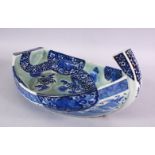 A JAPANESE MEIJI PERIOD ARITA TAKARABUNE FORMED BLUE & WHITE PORCELAIN DISH, decorated interior with