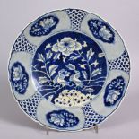 A CHINESE EXPORT BLUE & WHITE PORCELAIN PLATE - decorated with birds and floral displays, 26cm