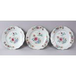 THREE 18TH CENTURY CHINESE FAMILLE ROSE FLORAL DECORATED PLATES, 22.5CM.