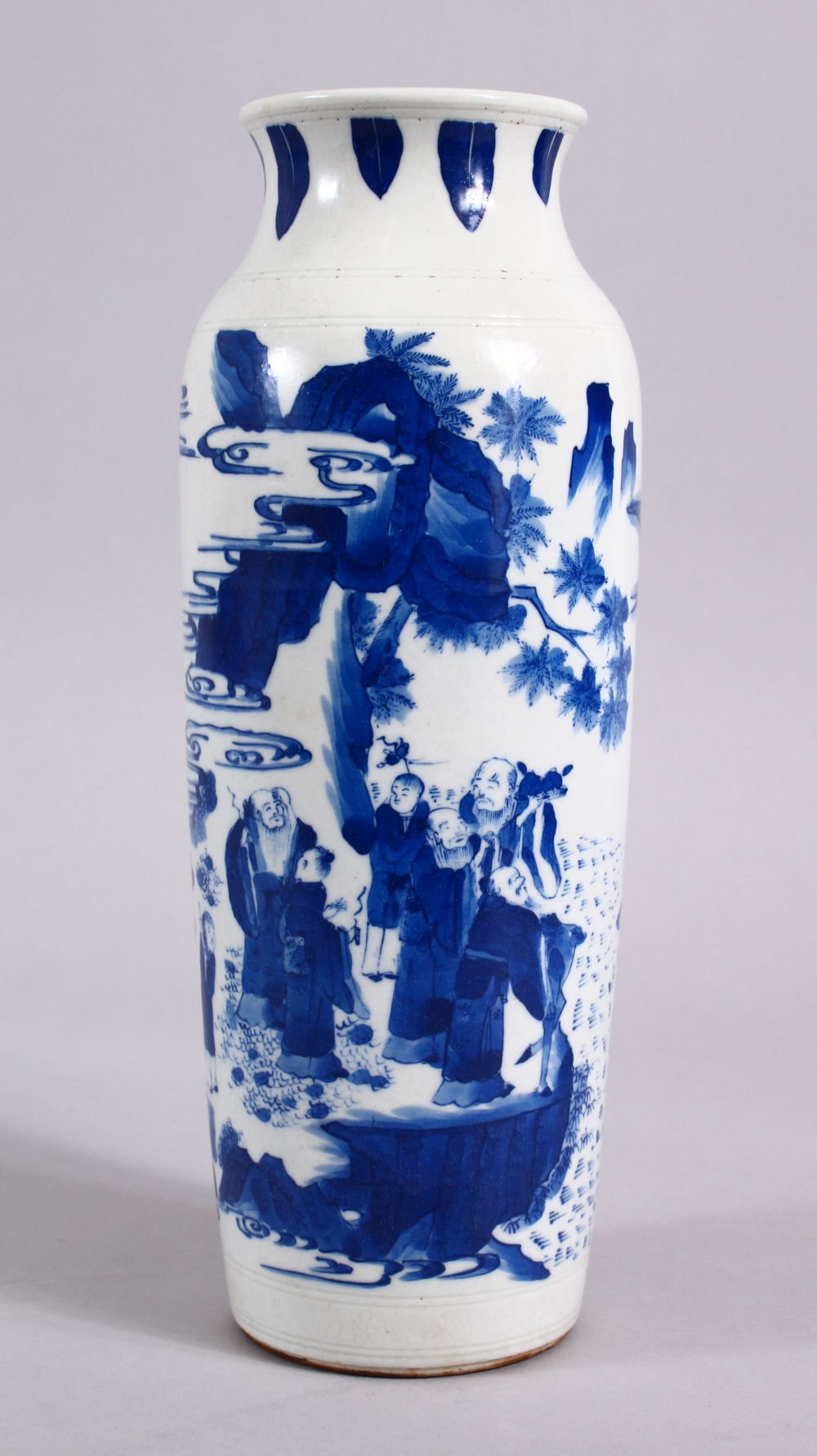 A CHINESE BLUE & WHITE TRANSITIONAL STYLE PORCELAIN SLEEVE VASE. decorated with immortal figures,