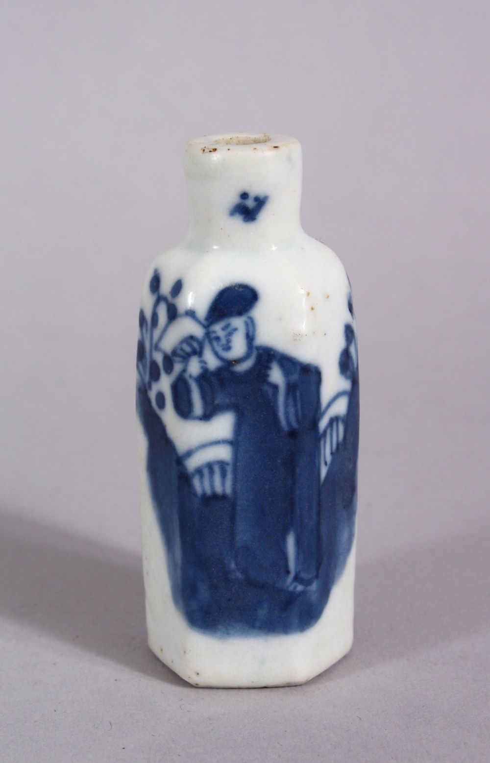 A CHINESE BLUE & WHITE PORCELAIN HEXAONAL FORM SNUFF BOTTLE, decorated with a figure in a garden,