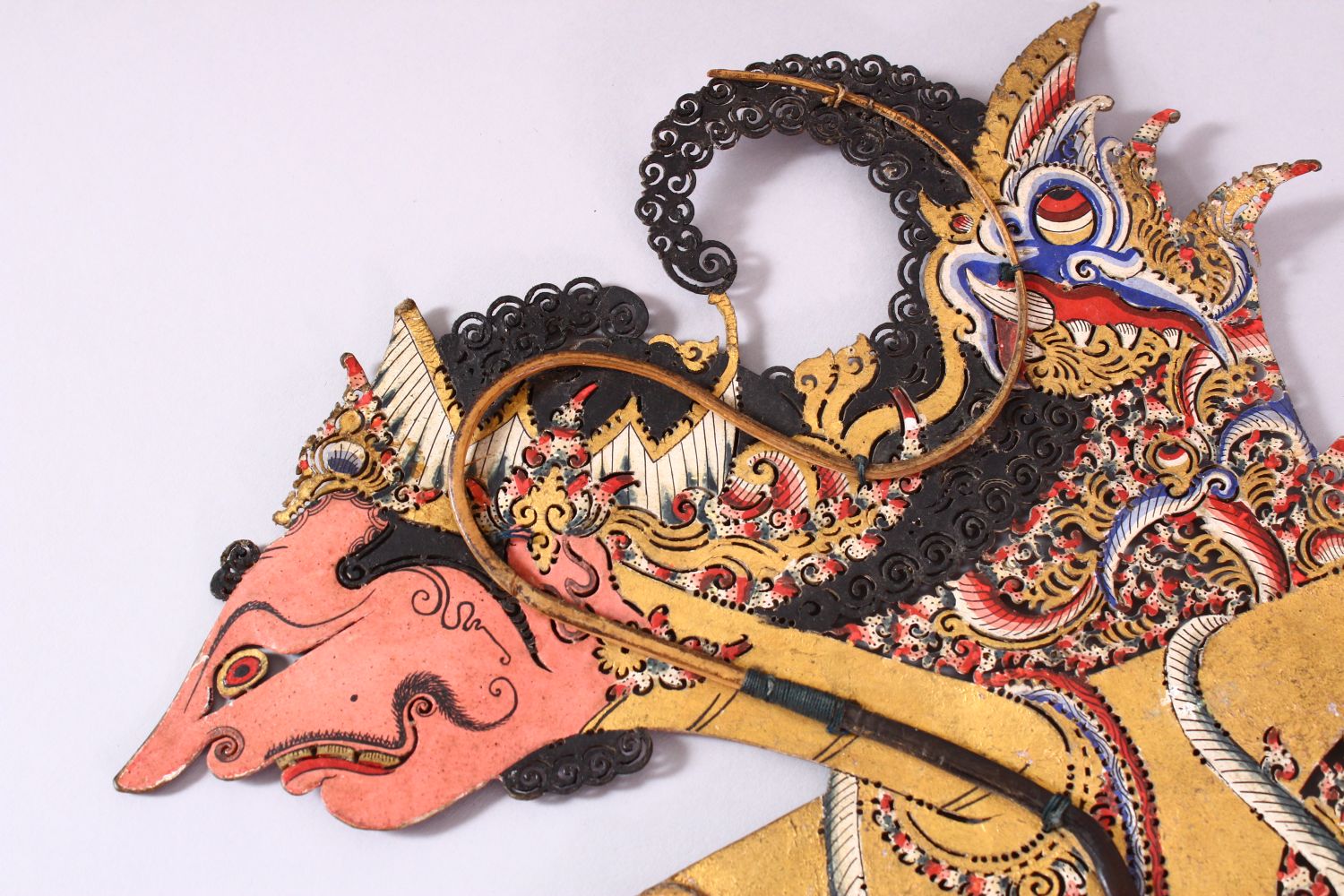 A LARGE 19TH CENTURY INDONESIAN SHADOW PUPPET WITH RHINO HORN STICKS, 73cm. - Image 7 of 7