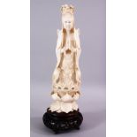 A LARGE 19TH CENTURY CHINESE CARVED IVORY FIGURE OF SEATED GUANYIN, seated upon carved lotus, in