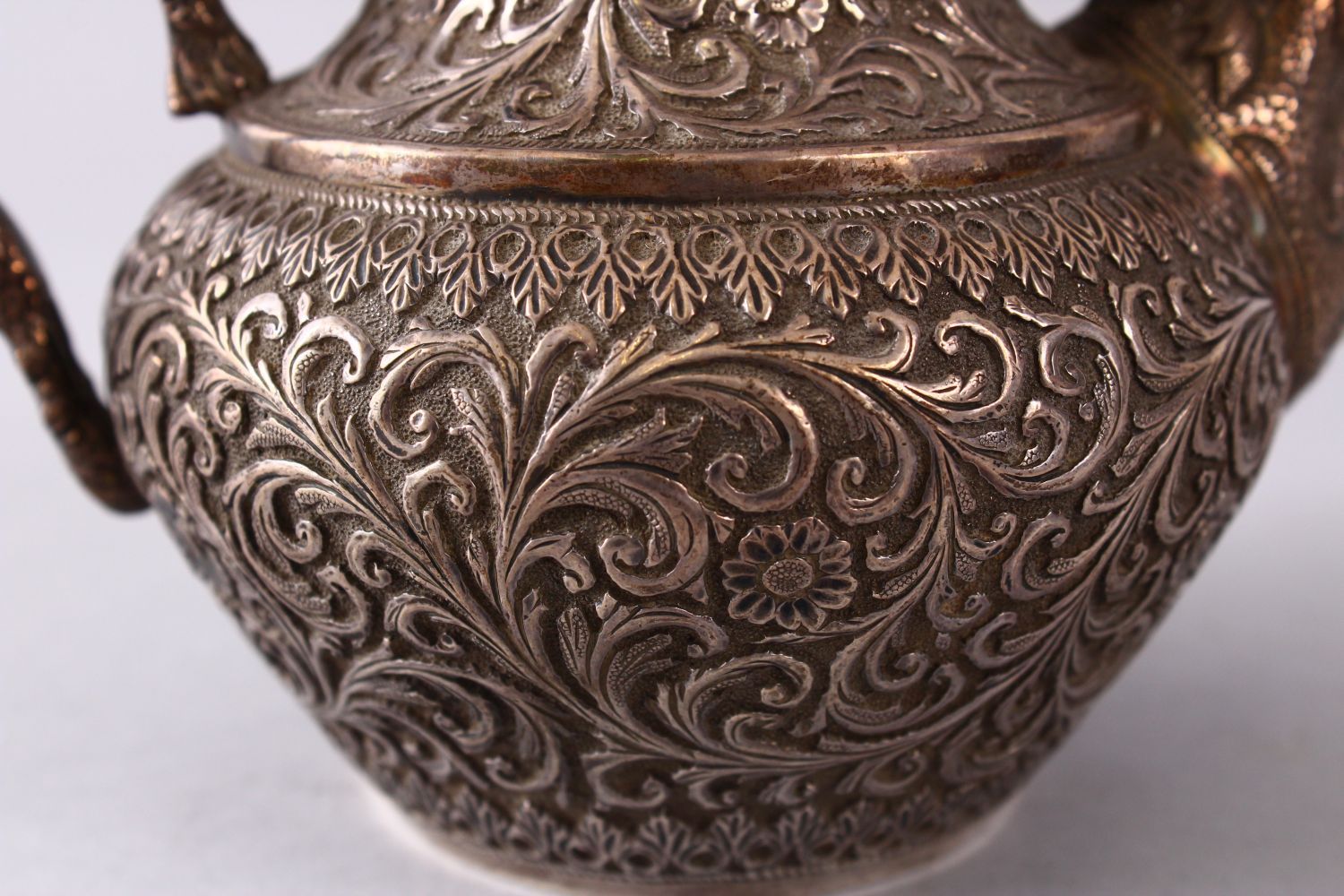 A GOOD 19TH CENTURY TURKISH SOLID SILVER TEAPOT carved with formal foliage and a dog style handle, - Image 9 of 10