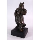 A 19TH CENTURY CHINESE BRONZE FIGURE OF GUANDI - in a striding pose with a wooden base, 22cm x 12cm