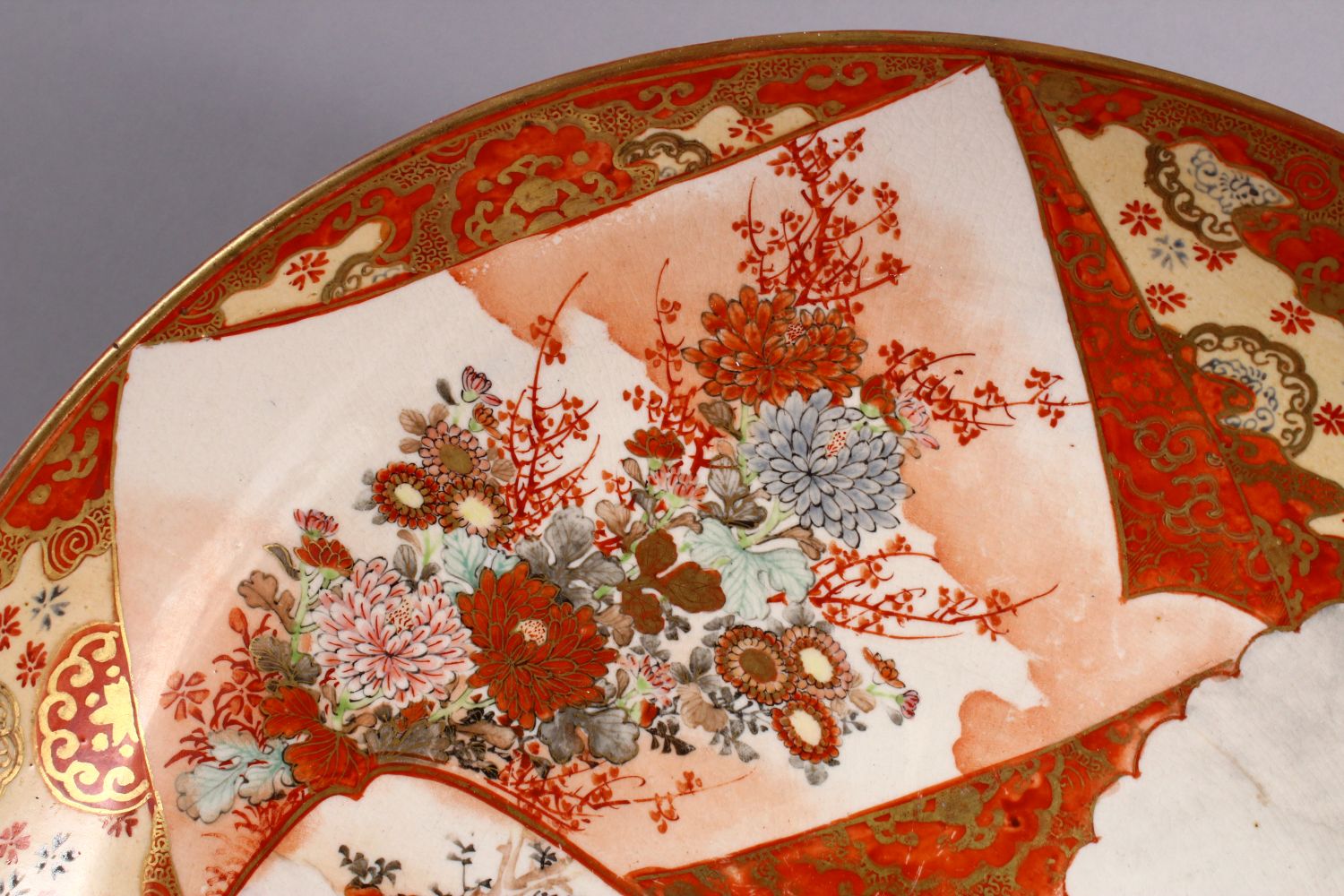 A JAPANESE MEIJI PERIOD KUTANI PORCELAIN CHARGER, with decoration of figures exterior, birds amongst - Image 3 of 6