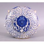 AN OTTOMAN TURKISH IZNIK STYLE POTTERY WATER FLASK, 21cm wide x 18cm high