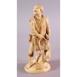 A JAPANESE MEIJI PERIOD CARVED IVORY OKIMONO OF A WOOD CUTTER, the man stood with his axe in