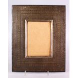 A 19TH CENTURY INDIAN GOLD INLAID STEEL PHOTO FRAME, 29cm X 23cm.