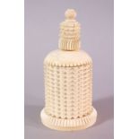 A 19TH CENTURY CARVED IVORY CYLINDRICAL BOX AND COVER - the cover possibly a marriage, 15cm.