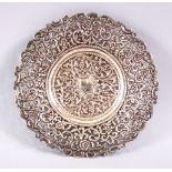 A 19TH CENTURY INDIAN SILVER OPEN WORKED DISH, with formal floral decoration and openwork, 18cm.