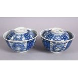 A PAIR OF 19TH CENTURY CHINESE BLUE & WHITE PORCELAIN TEA BOWLS & COVERS, with panel decoration of