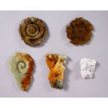 A COLLECTION OF FIVE CHINESE CARVED JADE PENDANTS, one of a dragon on currency, one of rats, one