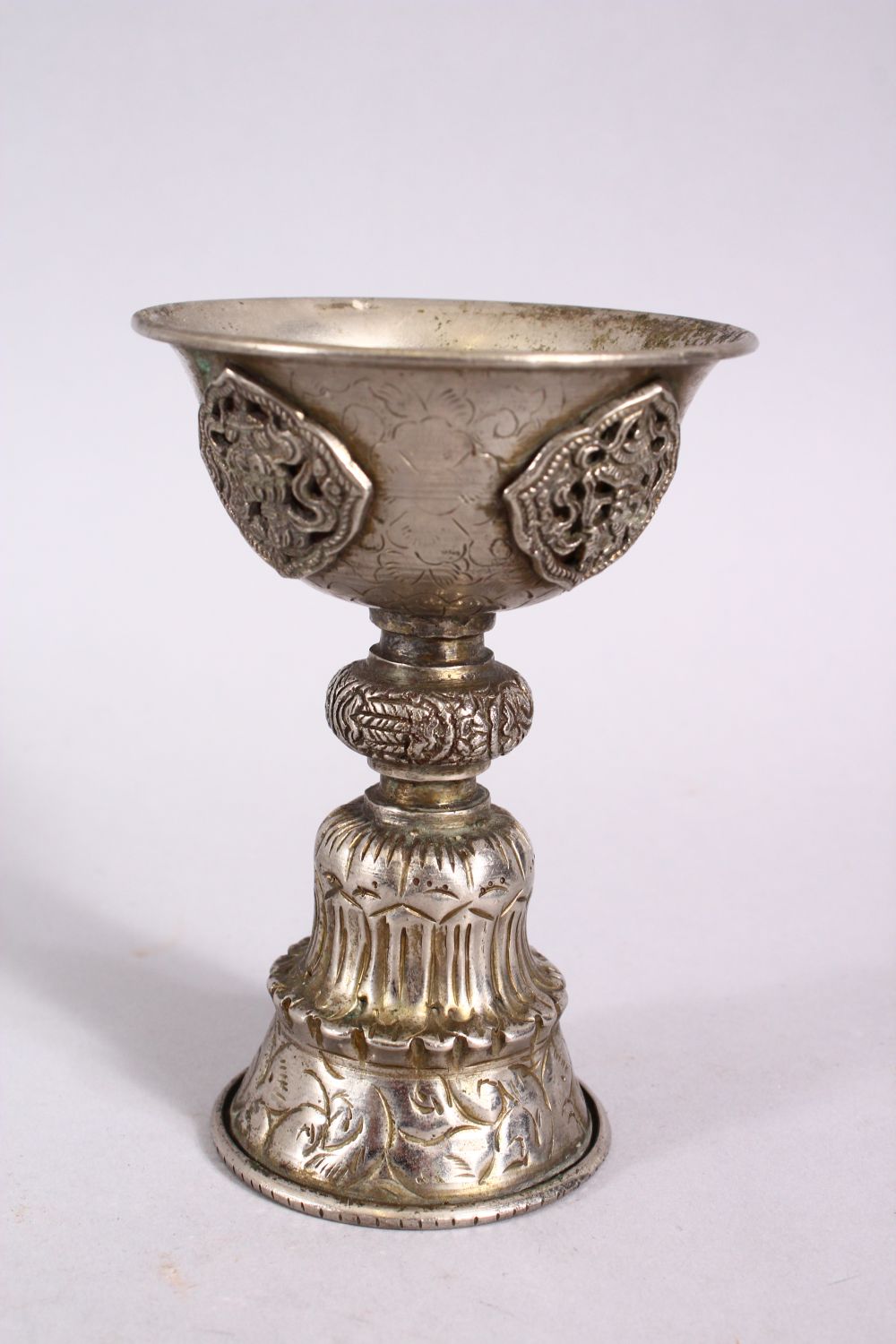 A GOOD 19TH CENTURY SINO TIBETAN WHITE METAL STEM CUP, with buddhistic object decoration, 11.5cm - Image 2 of 4