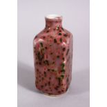 A CHINESE PEACH BLOOM PORCELAIN SNUFF BOTTLE, with a bloom glaze, the base with a fouor character