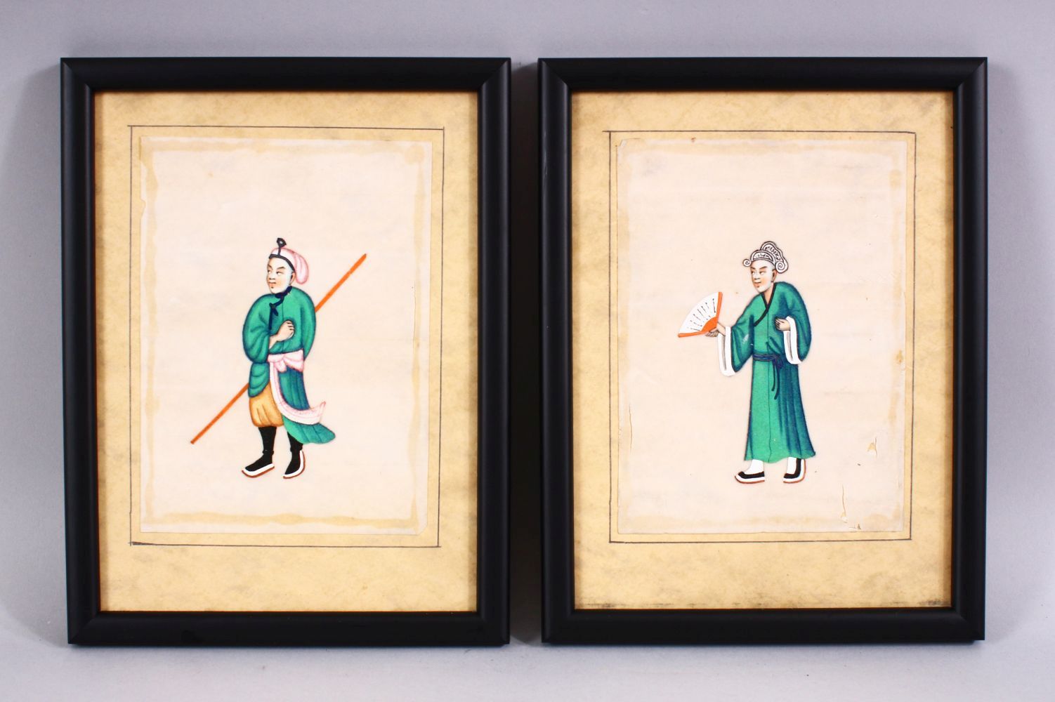 A PAIR OF 19TH CENTURY CHINESE RICE PAPER PAINTINGS, each depicting figures, one with a fan the