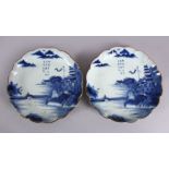 A PAIR OF JAPANESE MEIJI PERIOD BLUE & WHITE ARITA PORCELAIN DISHES, each decorated with native