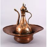 A 19TH CENTURY TURKISH OTTOMAN COPPER BASIN & EWER, The ewer with silver traces, 36cm high , the