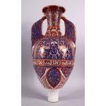 A 19TH CENTURY ISLAMIC SPANISH HISPANO - MORESQUE POTTERY TWIN HANDLE GAZELLE VASE, with a lustre