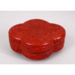 A 20TH CENTURY CHINESE CARVED CINNABAR LACQUER BOX & COVER, carved to depict formal rosette and