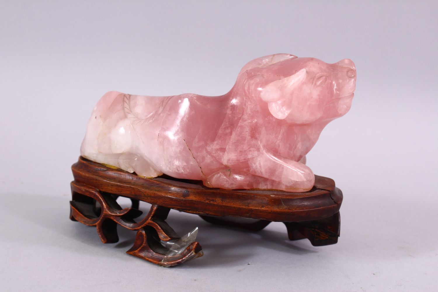 A CHINESE CARVED ROSE QUARTZ FIGURE OF A RECUMBENT OXEN, in a led position upon a carved hardwood - Image 3 of 5