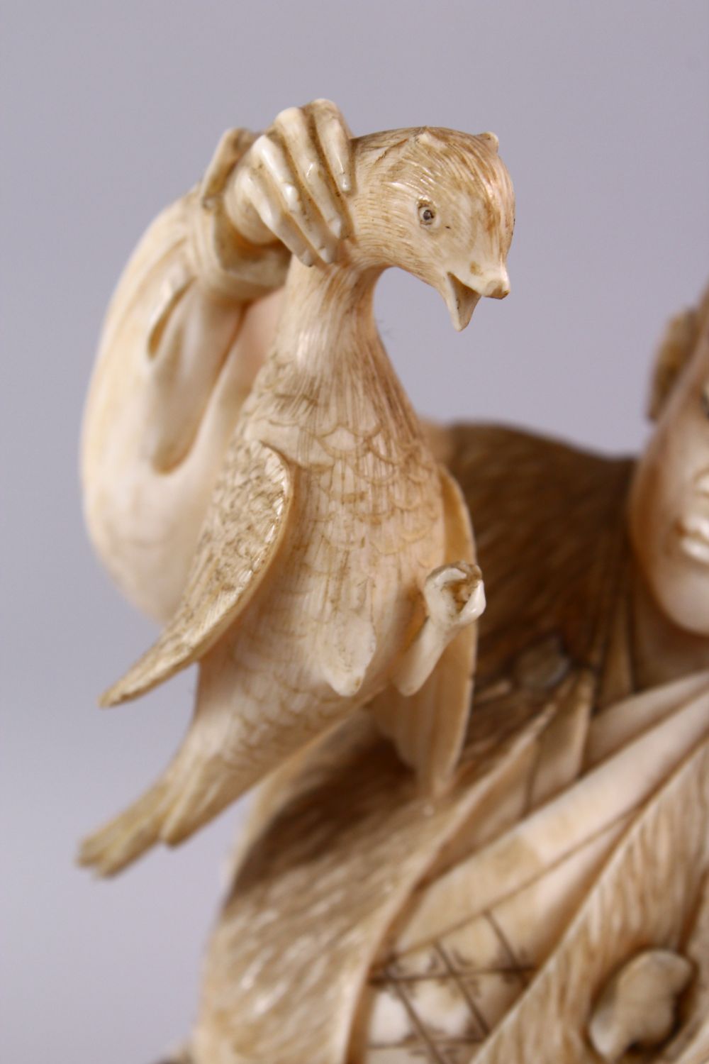 A FINE JAPANESE MEIJI PERIOD CARVED IVORY OKIMONO OF A HUNTSMAN, stood holding his catch with his - Image 6 of 6