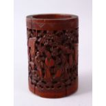 A 19TH CENTURY CHINESE CARVED BAMBOO CANTON BRUSH POT, decorated with figures amongst garden